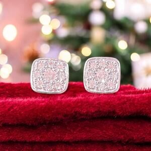 Gorgeous white gold rhodium over sterling silver .25CTW diamond earrings